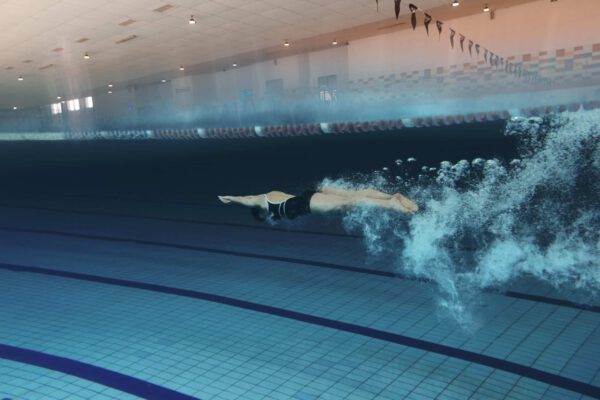 swimmer-with-equipment-pool-full-shot